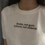 Load image into Gallery viewer, Books, not guns. Culture, not violence.
